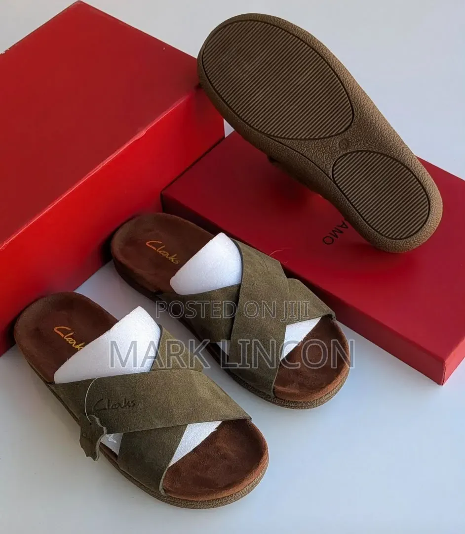 Clarks Men's Suede Slide Sandals Feature a Distinct Brown Cross-Strap