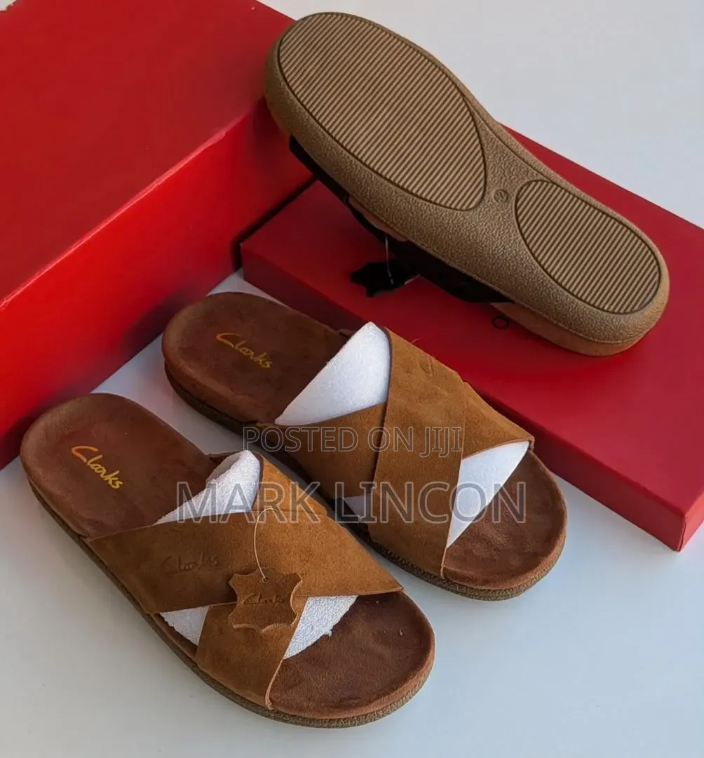 Clarks Men's Suede Slide Sandals Feature a Distinct Brown Cross-Strap