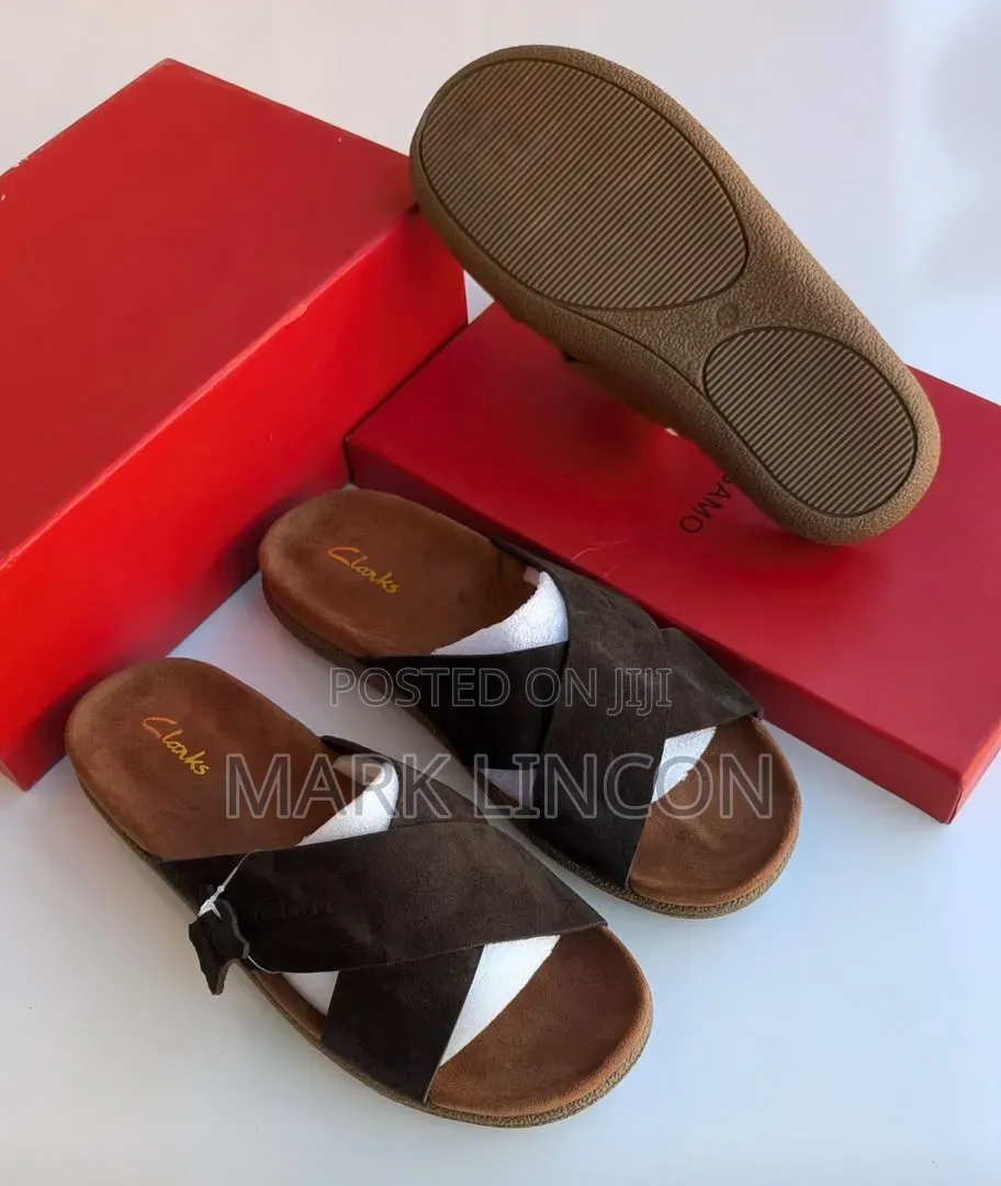 Clarks Men's Suede Slide Sandals Feature a Distinct Brown Cross-Strap