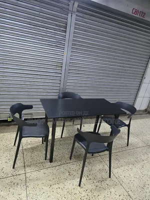 Ergonomic Dining Wooden Table and Plastic Chairs