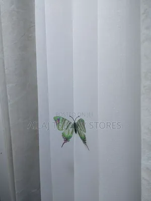 Light Cream Curtains and White Nets Per Metre