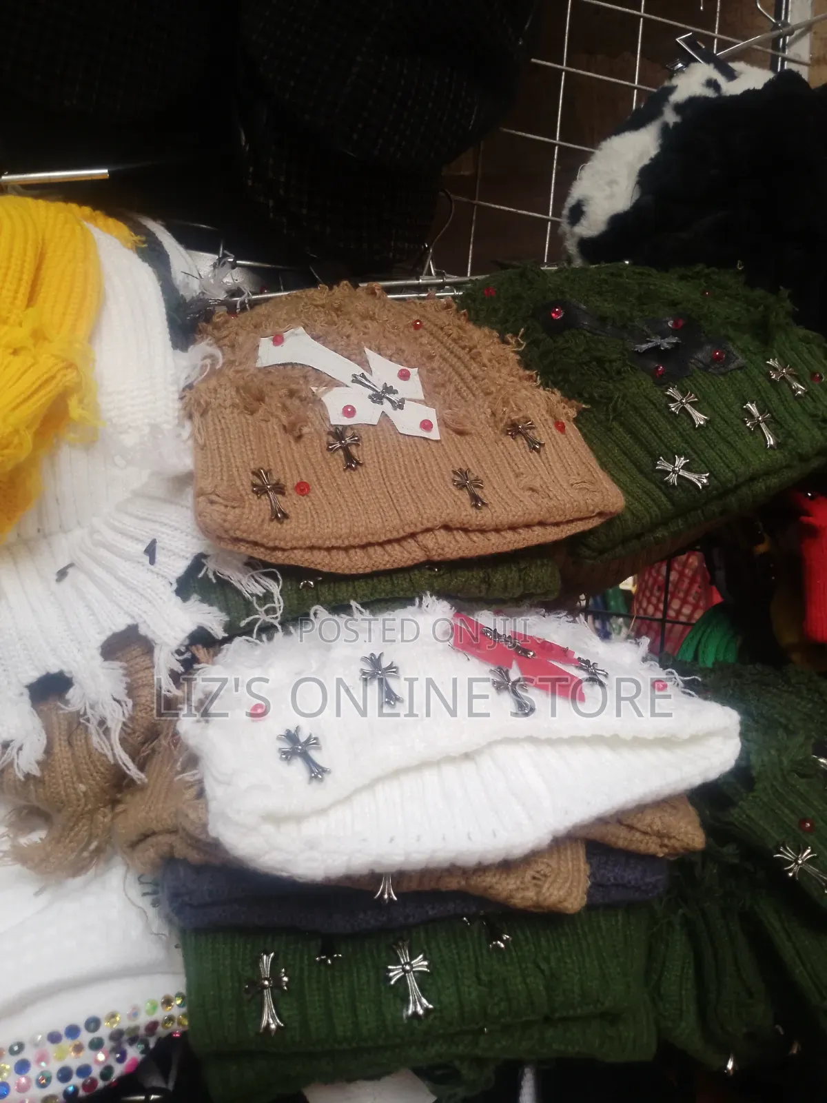 Distressed, Knitted Winter Qbeanie Featuring Metallic Cross Charms.