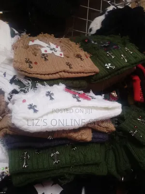 Distressed, Knitted Winter Qbeanie Featuring Metallic Cross Charms.