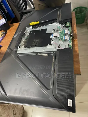 Disassembled TCL Tv Undergoing Maintenance or Repair.