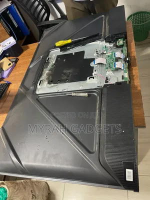 Dismantled Television Layout on a Workbench
