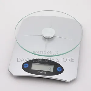 5kg Digital Kitchen Scale Has a Clear Glass Platform and a Silver Base