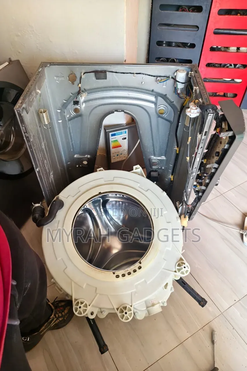 Front-Loading Washing Machine Undergoing Internal Repairs