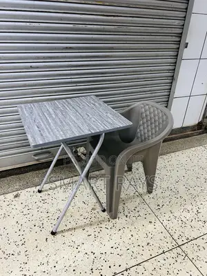 Reading Foldable Table and a Plastic Chair
