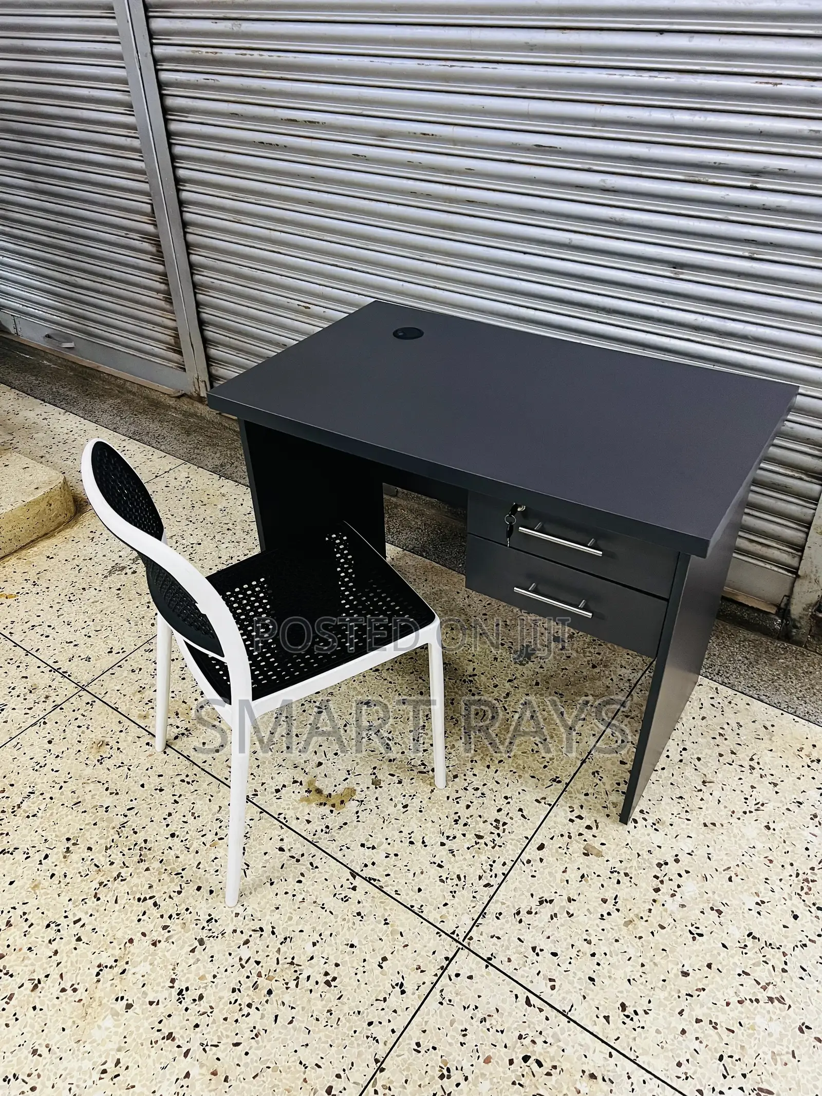Office Table and a Plastic Chair