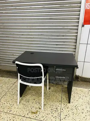 Office Table and a Plastic Chair