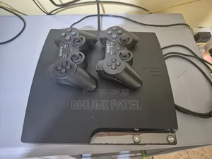 Ps 3 Slim With 2 Controllers,7 Games and Charger