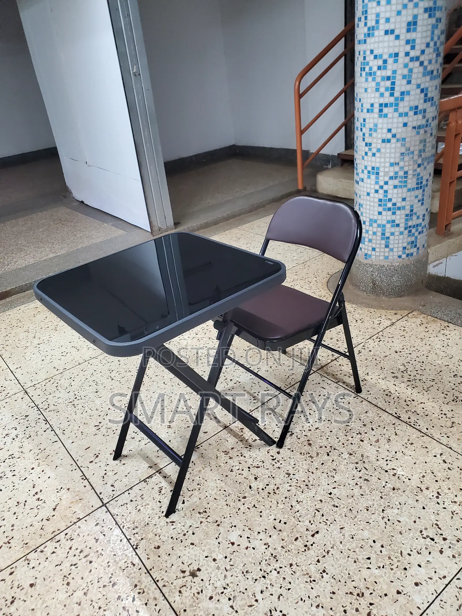 Folding Glass Table and a Folding Leather Chair