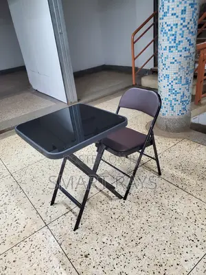 Folding Glass Table and a Folding Leather Chair