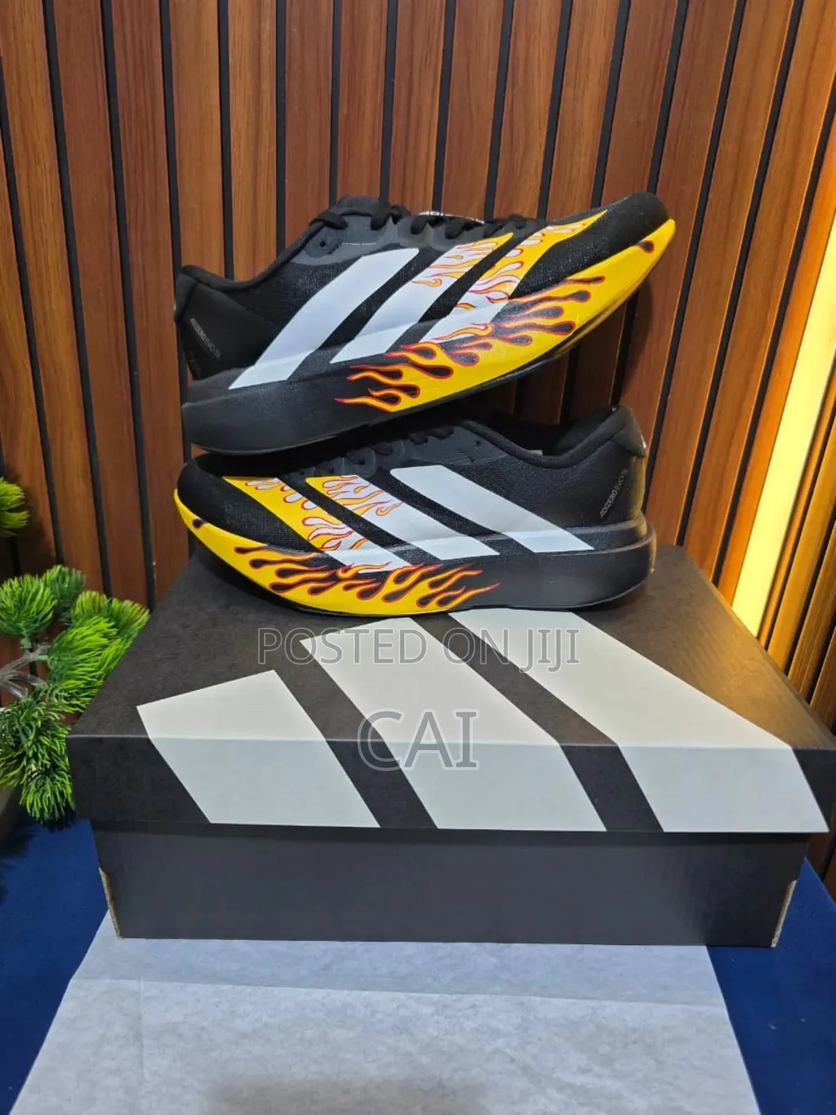 Adidas Adizero EvoBlack and White With a Flame Graphic Pattern