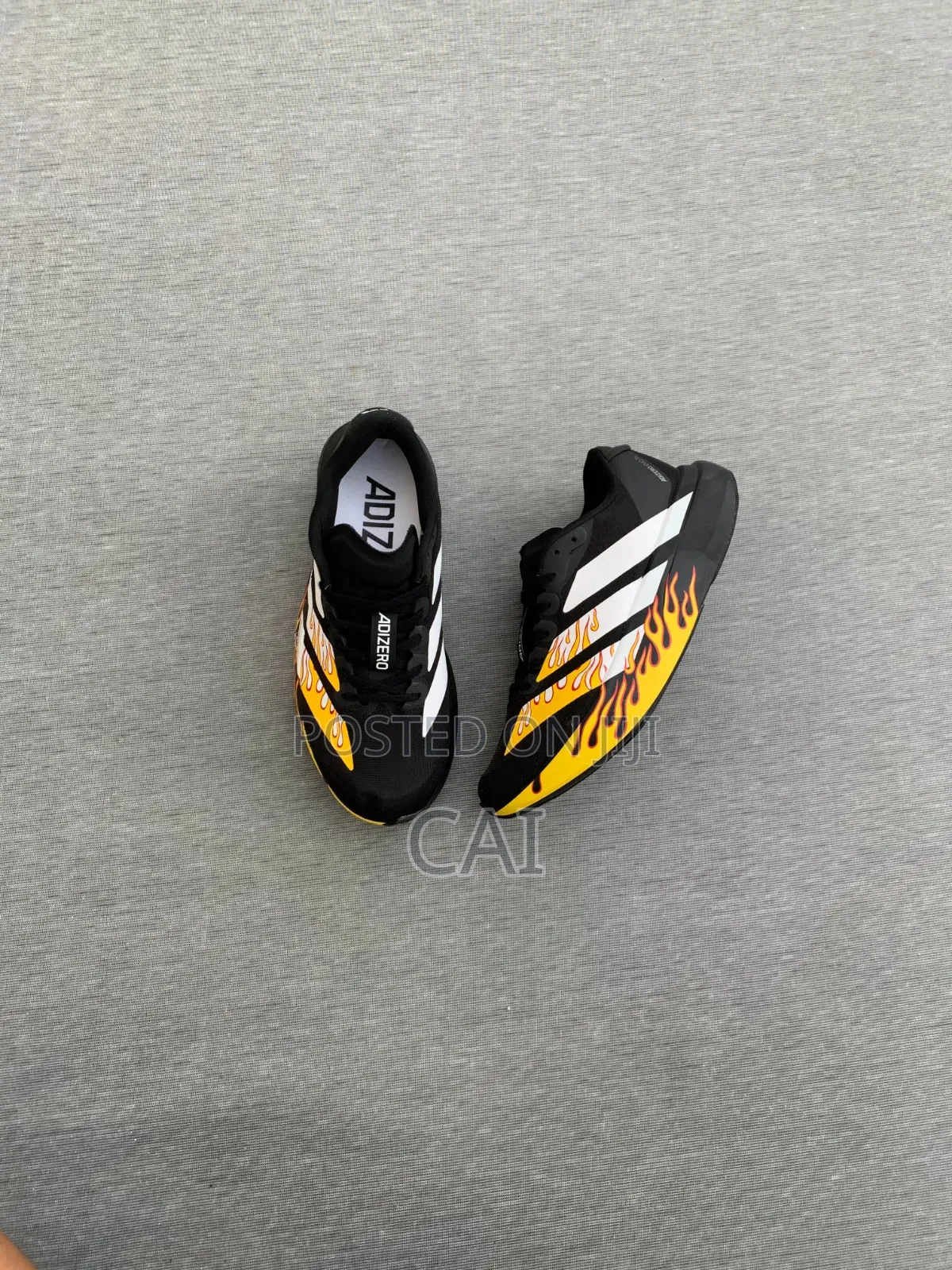 Adidas Adizero EvoBlack and White With a Flame Graphic Pattern