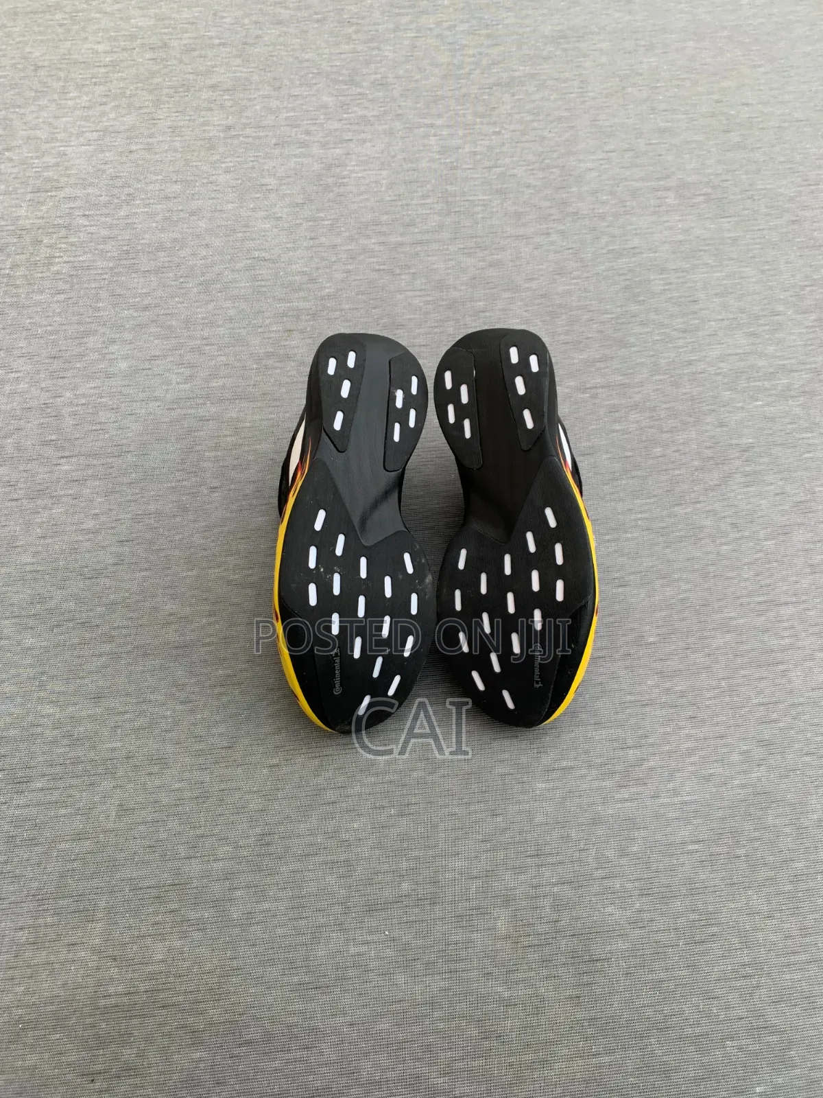 Adidas Adizero EvoBlack and White With a Flame Graphic Pattern