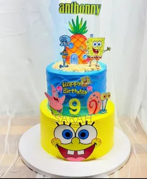 Vibrant Two-Tier SpongeBob SquarePants Birthday Cake.