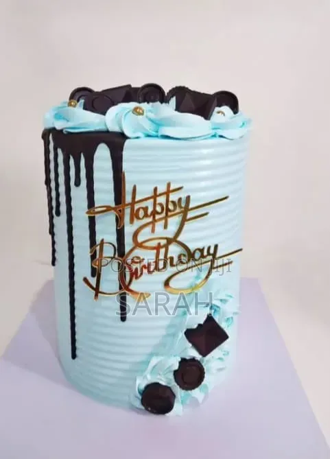 Tall, Light Blue Striped Birthday Cake.