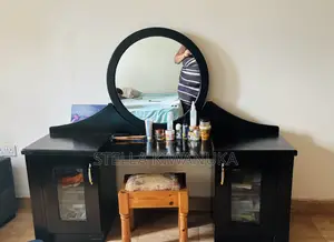 Black Dresser With a Mirror