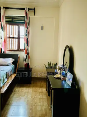 Black Dresser With a Mirror