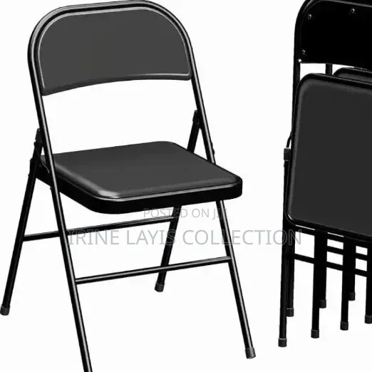 Folding Chair Featuring a Padded Vinyl Seat .