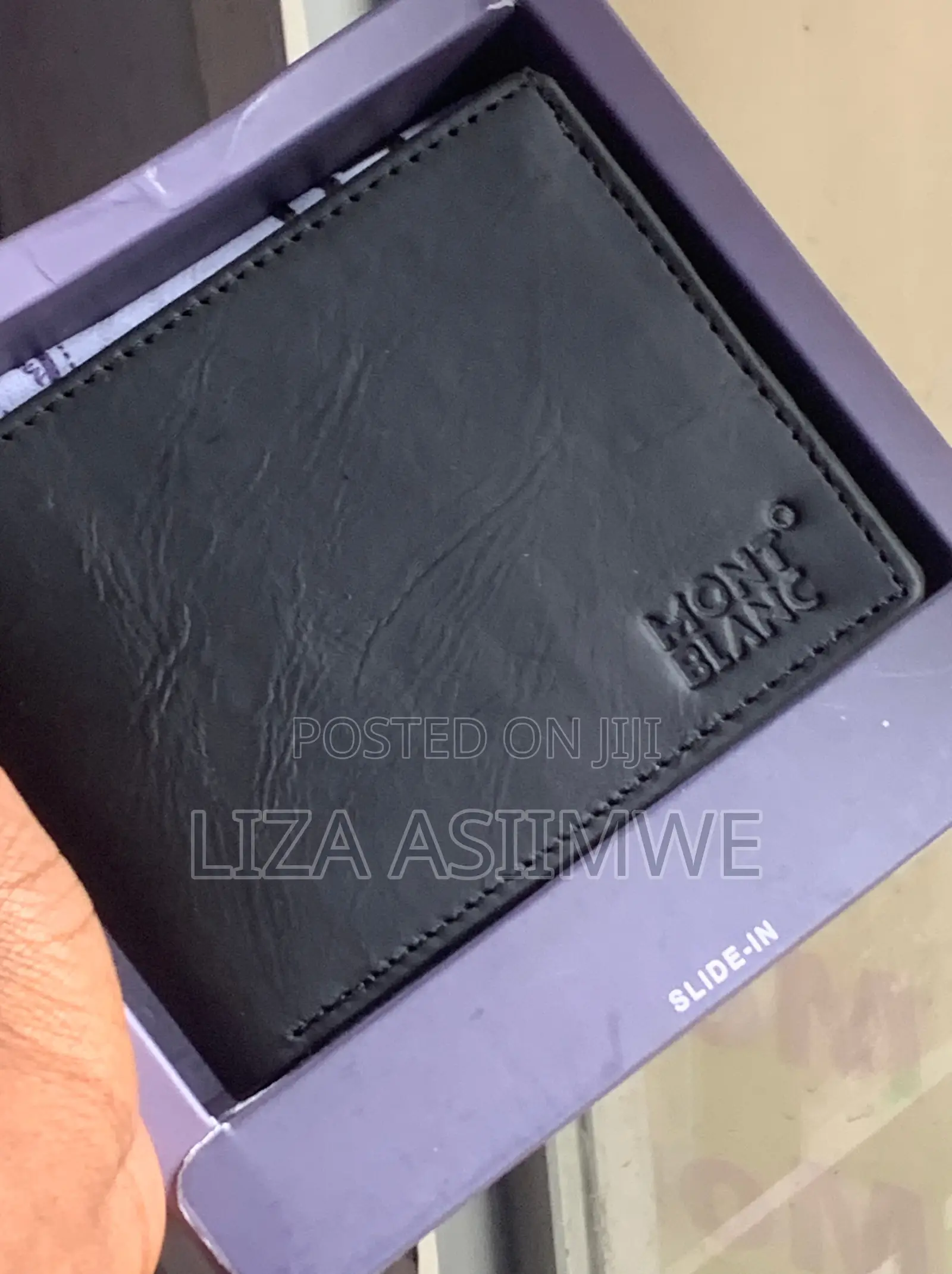 Montblanc Black Leather Wallet Featuring a Stamped Brand Logo On