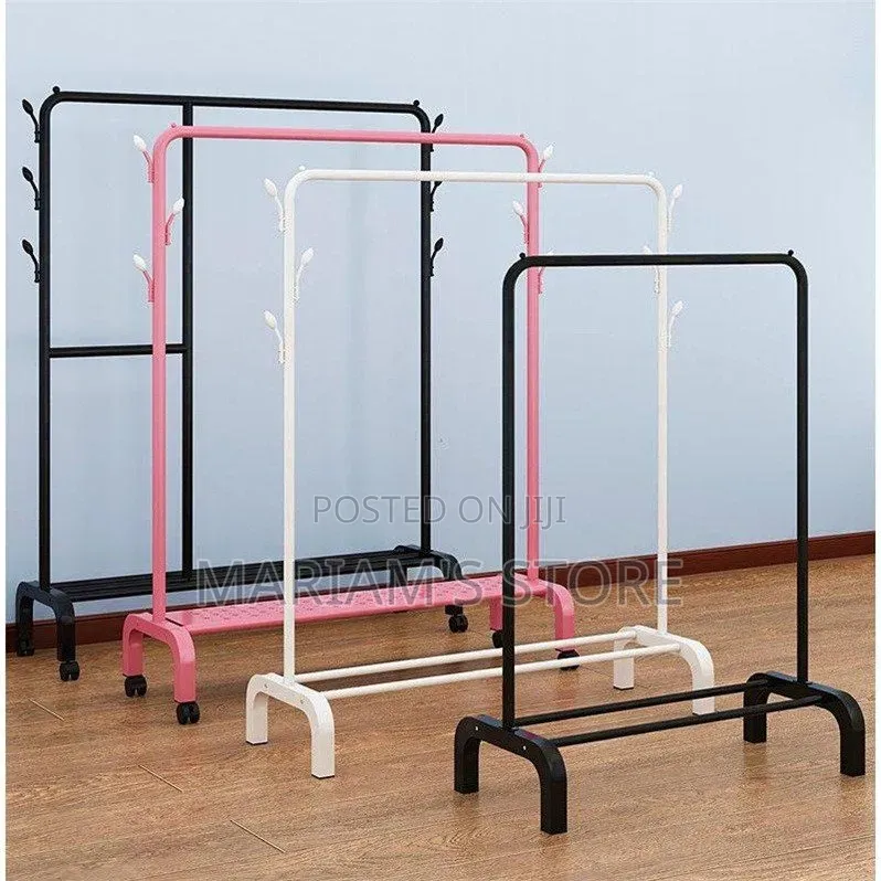 Metal Garment Rack Features Wheels for Portability and a Shoe Storage.