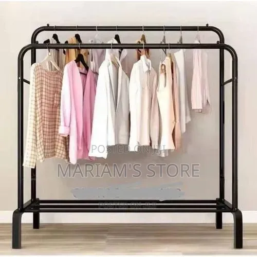 Metal Garment Rack Features Wheels for Portability and a Shoe Storage.