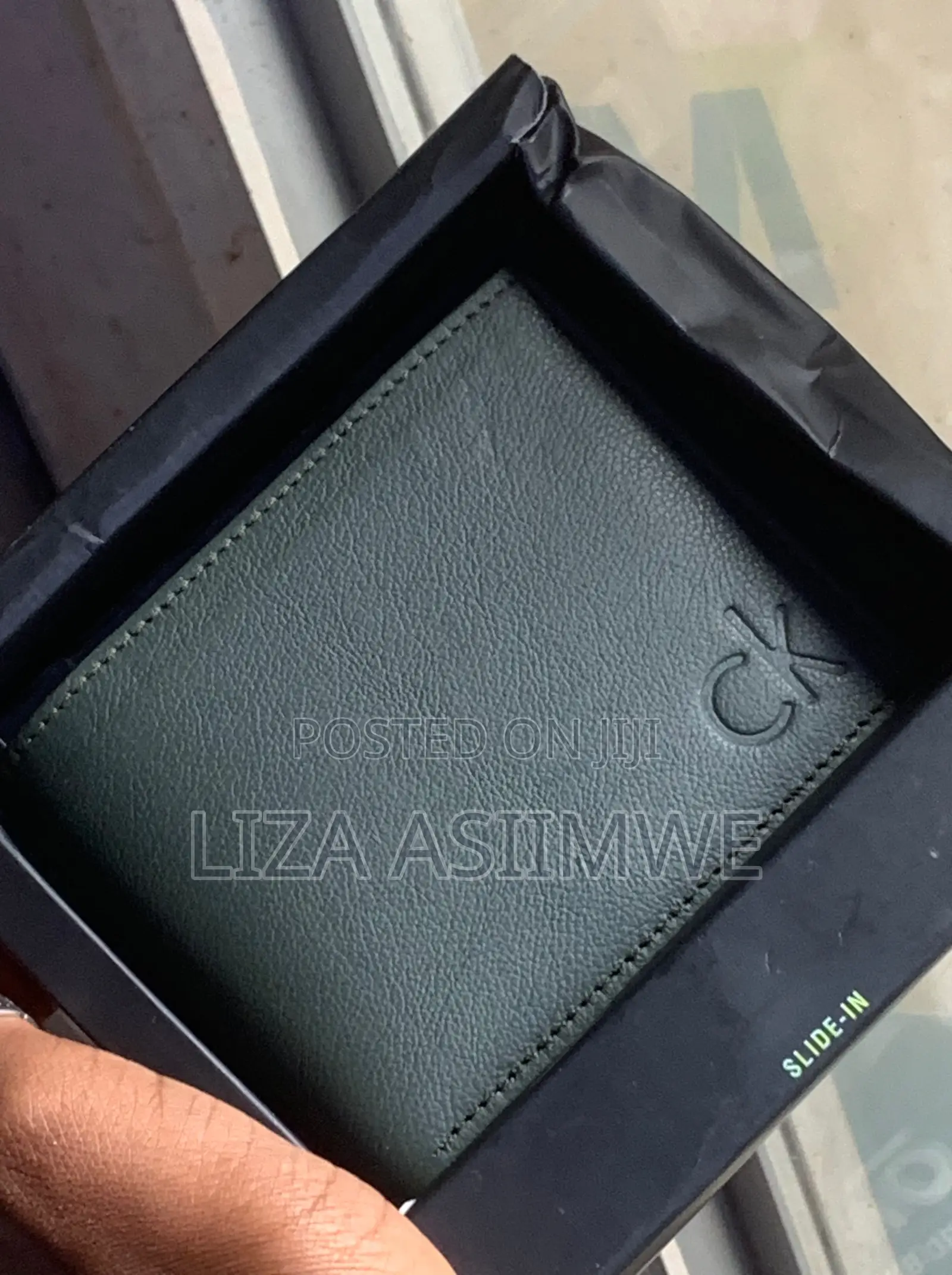 Calvin Klein Bi-Fold Wallet Featuring a Debossed Monogram Logo On