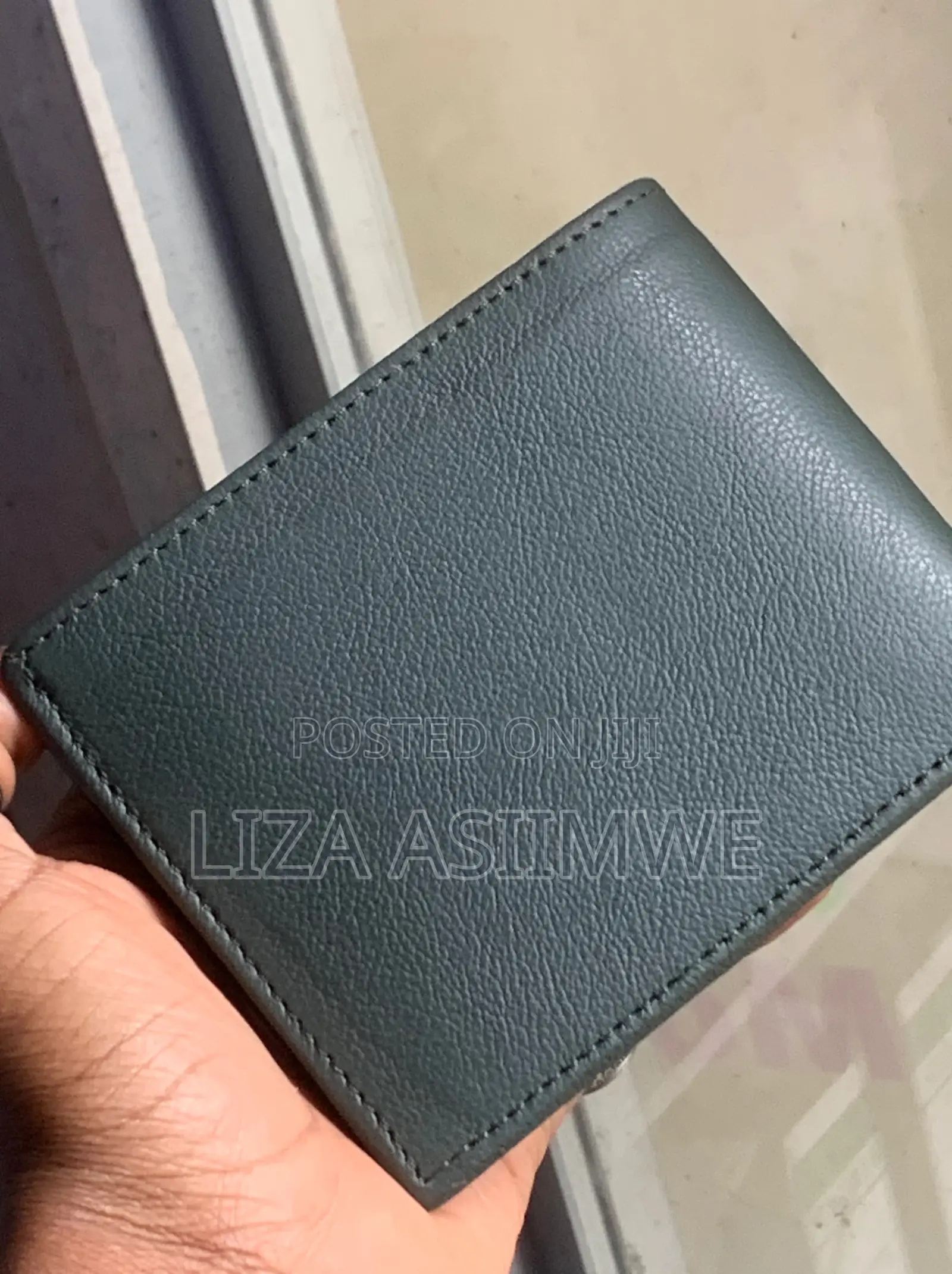 Calvin Klein Bi-Fold Wallet Featuring a Debossed Monogram Logo On