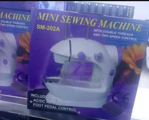 Mini Sewing Machine Featuring a Purple and White Design.