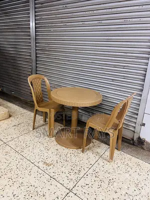 Round Plastic Table With Two Plastic Chairs