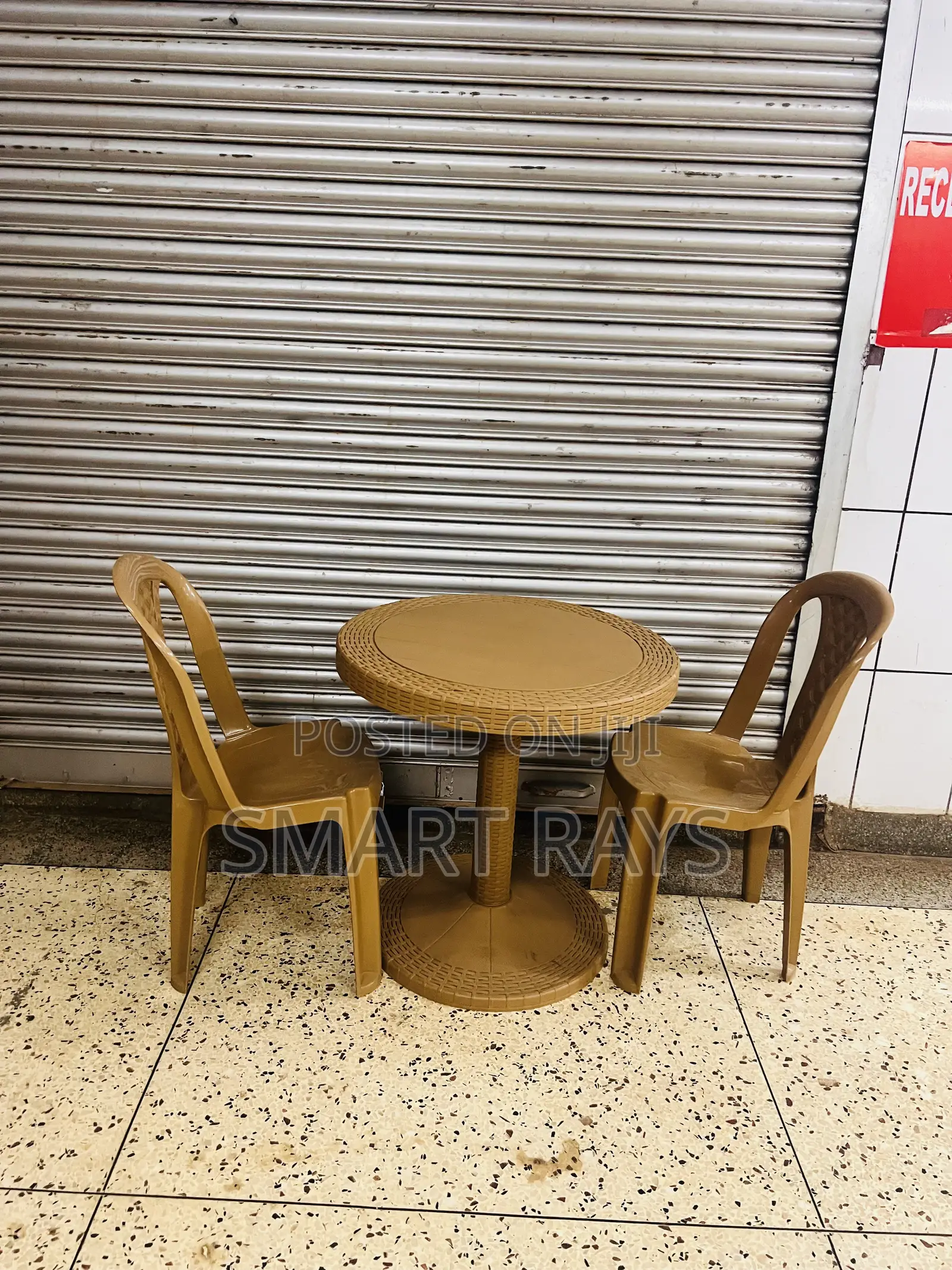 Round Plastic Table With Two Plastic Chairs