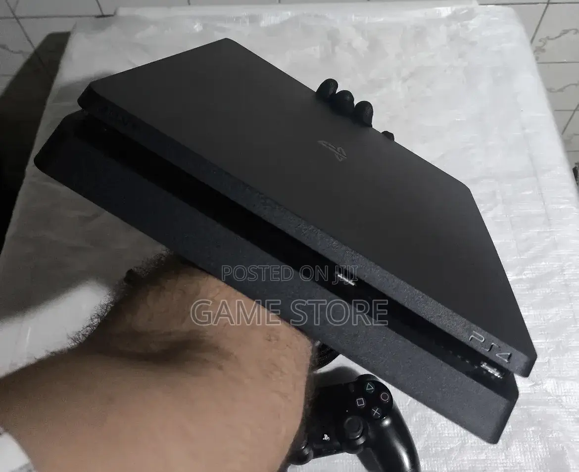 PS4 Fat Chipped, 12 Games + 2 Pads, UGX, EM Plaza Room 202