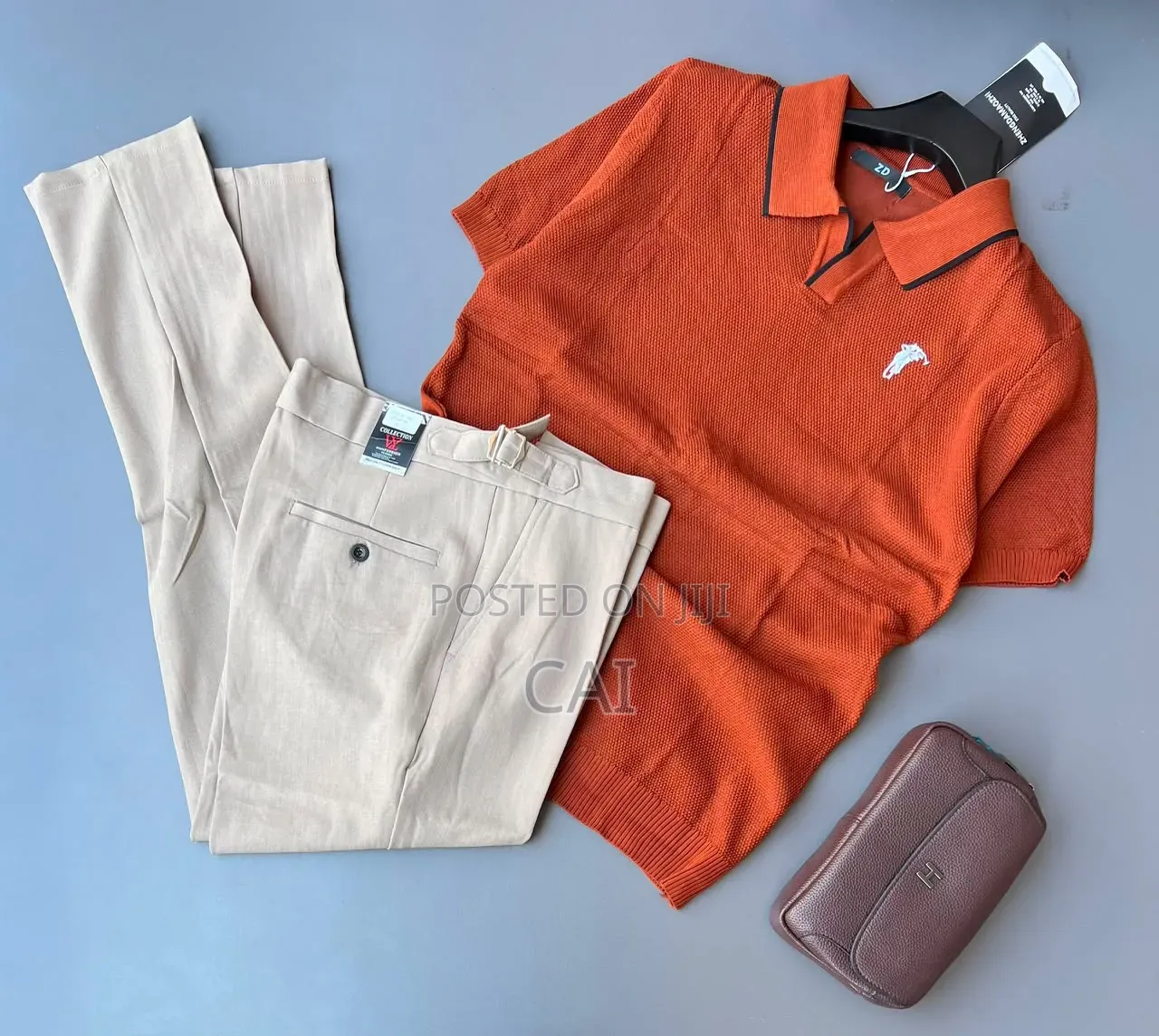 Polo Shirt Paired With Sleek, Belt-Less Trousers.