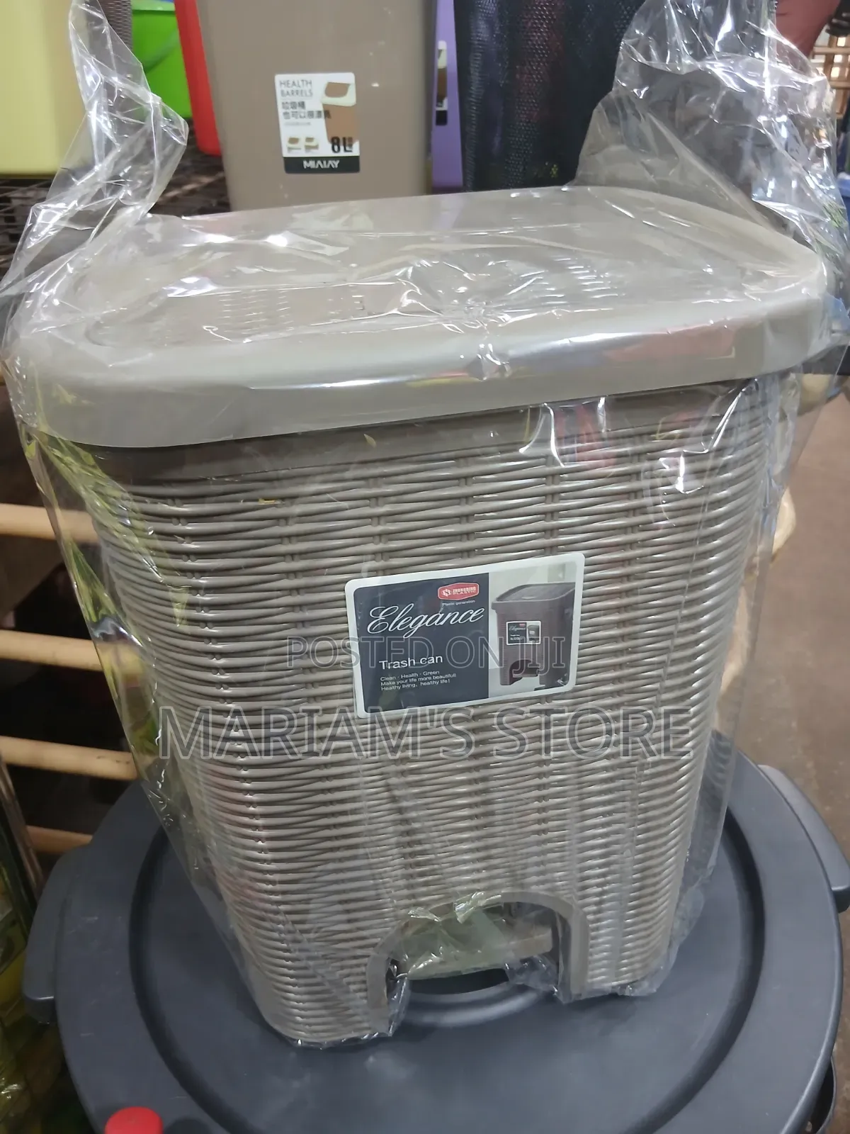 Plastic Trash Can With a Foot Pedal Mechanism.
