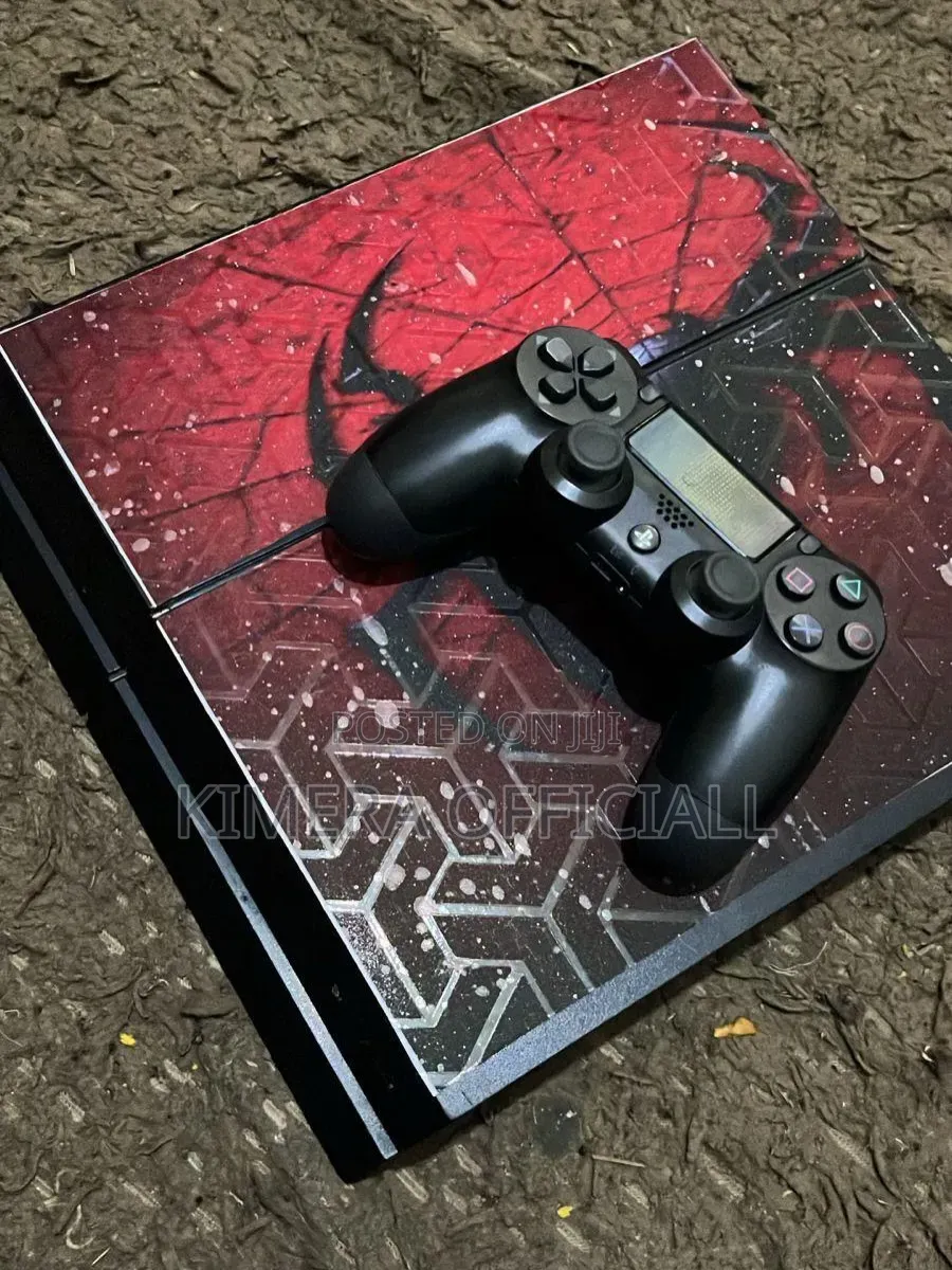Buy This PS4 With 12 Games and 2 Controllers to Play FC27 in Kampala
