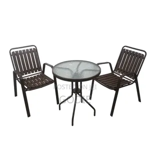Two Stackable Metal Chairs and a Round Glass-Topped Table. [1, 2]