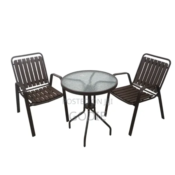 Two Stackable Metal Chairs and a Round Glass-Topped Table. [1, 2]