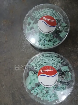 Clips, Push Pins, and Binder Clips in a Transparent Round Container