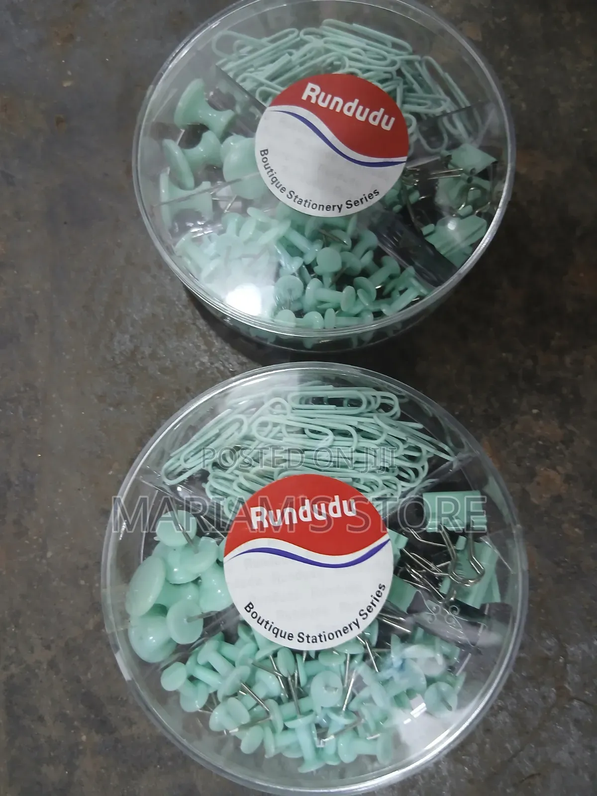 Clips, Push Pins, and Binder Clips in a Transparent Round Container