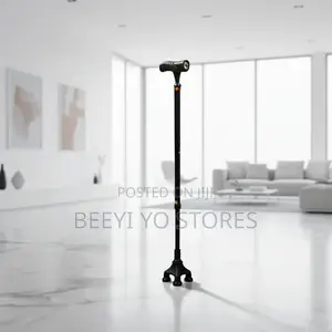 Quad-Base Adjustable Walking Cane With an Integrated LED Flashlight.