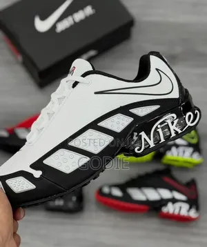 Nike Air Max TL Sneakers Featuring a White Upper, Black Overlays