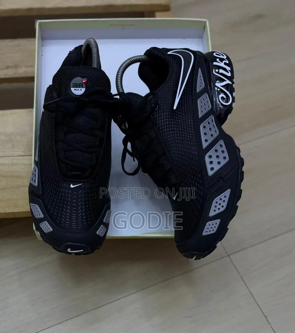 Nike Air Max TL Sneakers Featuring a White Upper, Black Overlays