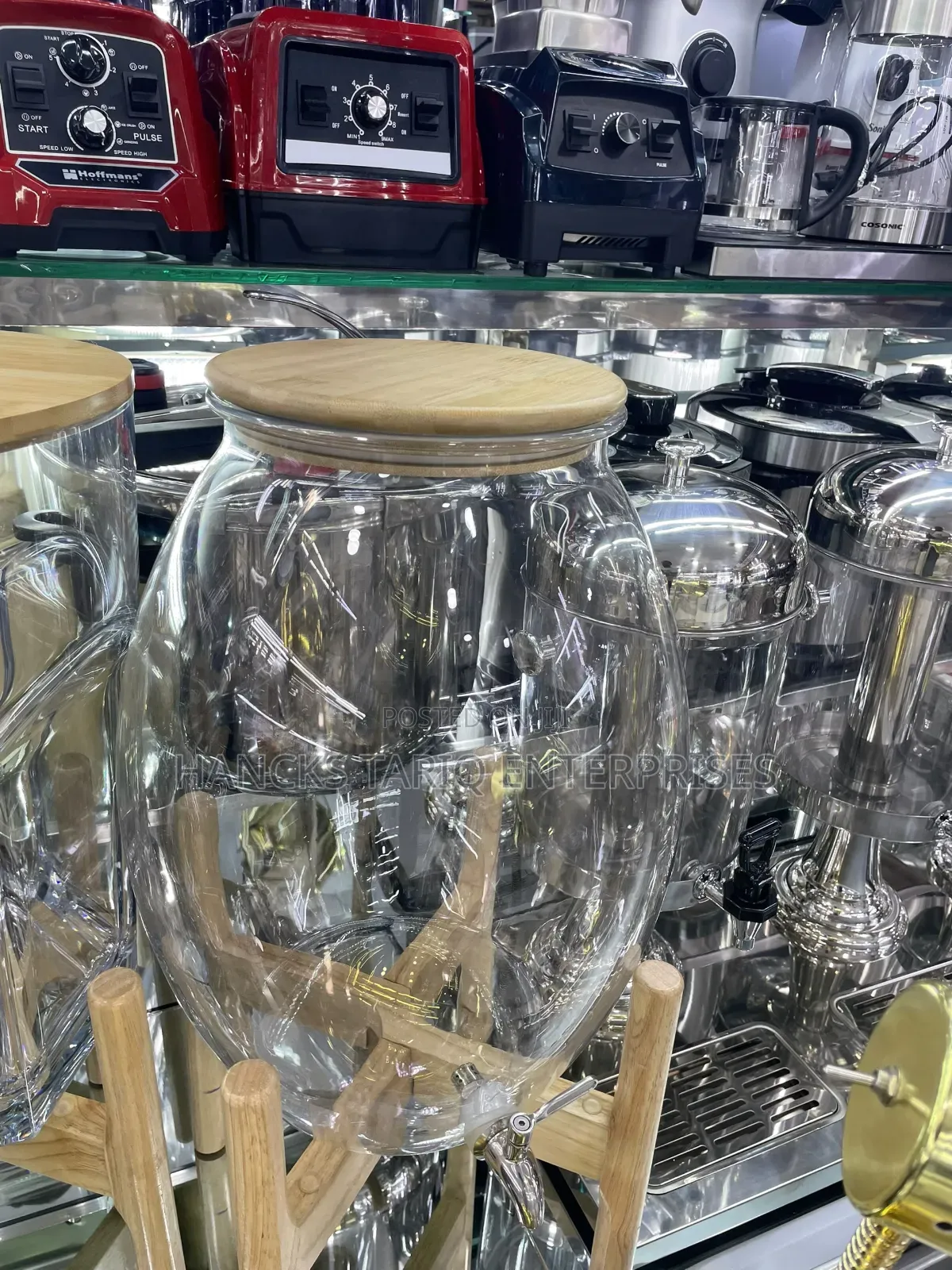Large Glass Beverage Dispenser With Wooden Lid and Stand.