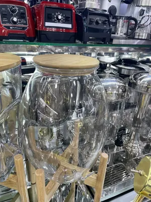 Large Glass Beverage Dispenser With Wooden Lid and Stand.