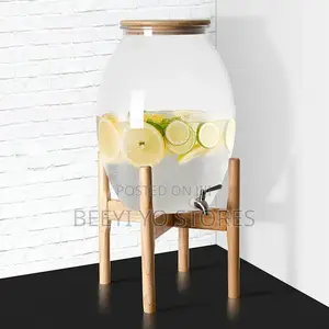 Large Glass Beverage Dispenser With Wooden Lid and Stand.