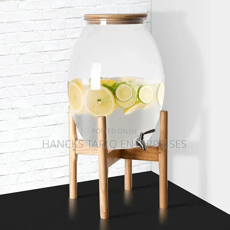 Large Glass Beverage Dispenser With Wooden Lid and Stand.