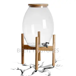 Large Glass Beverage Dispenser With Wooden Lid and Stand.