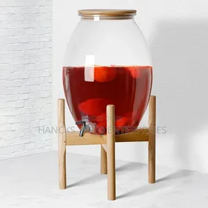 Large Glass Beverage Dispenser With Wooden Lid and Stand.
